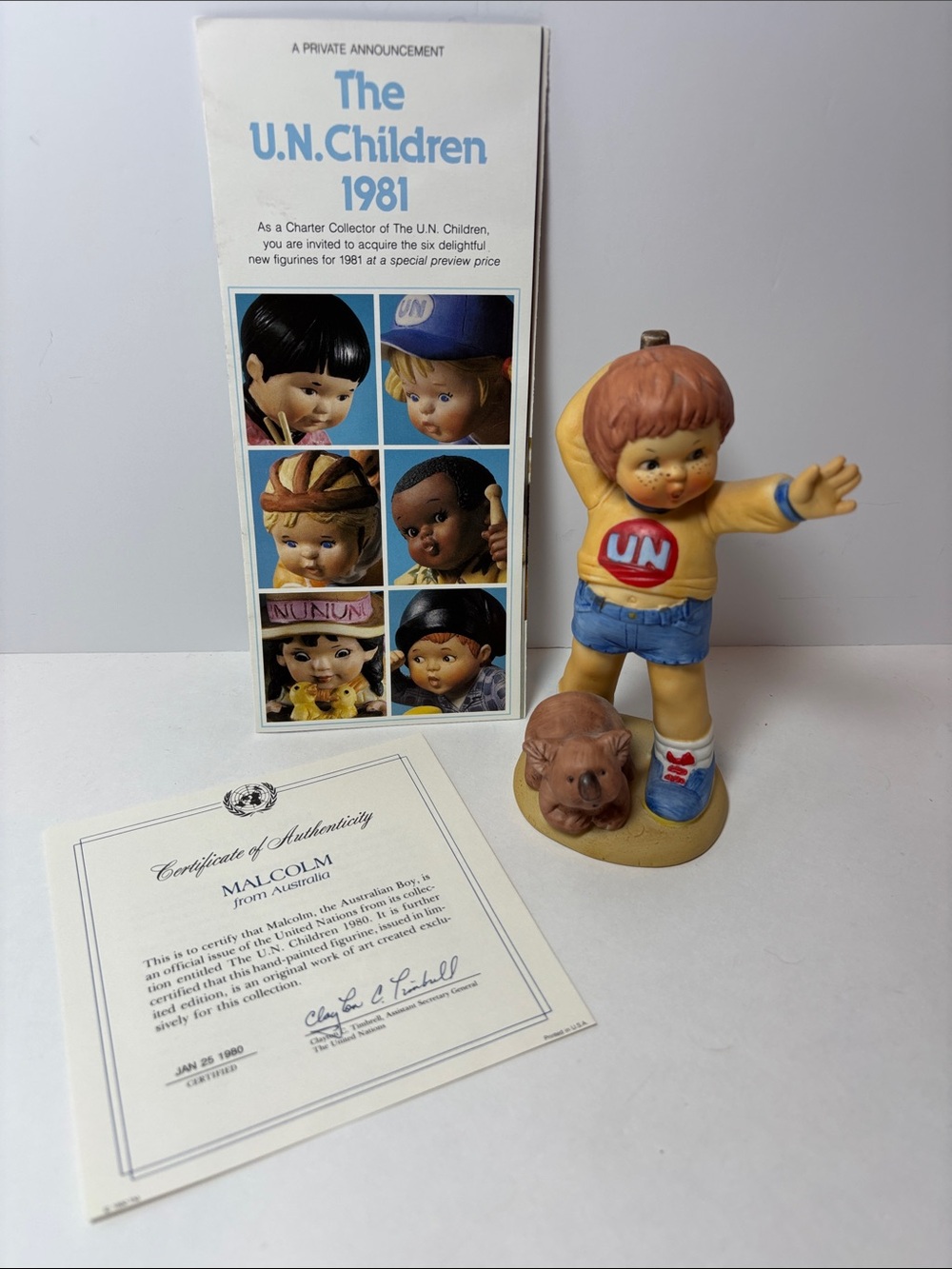 Franklin Mint Malcolm from Australia in Yellow & Blue with Tan Dog.